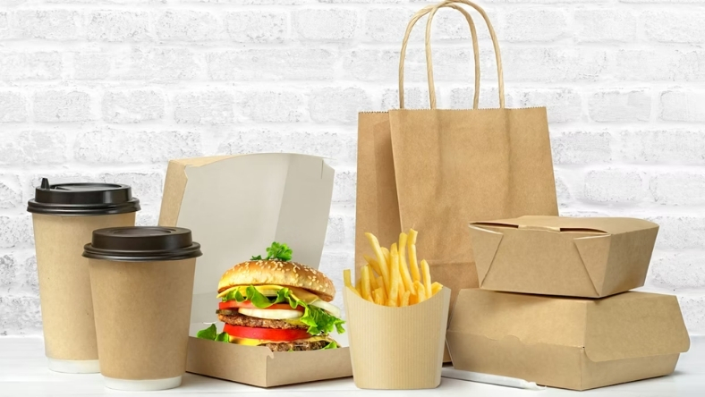 Burger box, fries and paper bags showing PFAS phase-out
