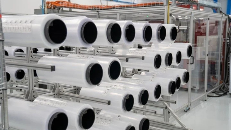 Rolls of multilayer film mounted on industrial rack system